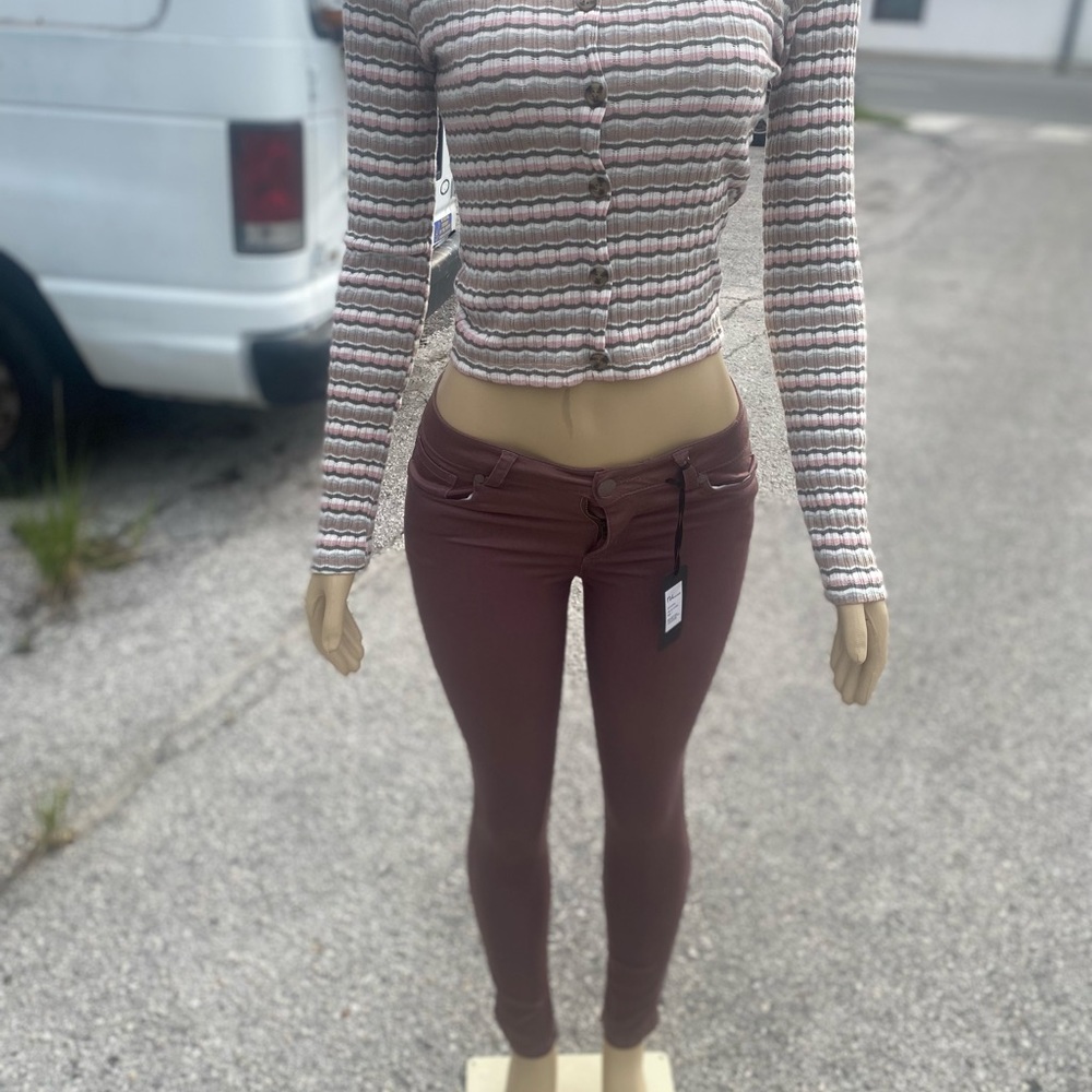 REVE JEANS AND TOP SELLING AS A SET. BROWN DOMINATES COLOR IN BOTH.
